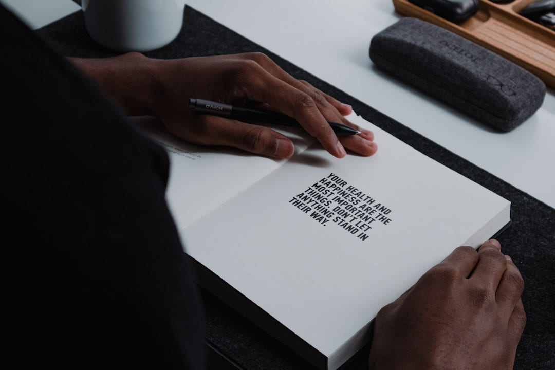 a person is writing on a piece of paper on Inner Progress Project