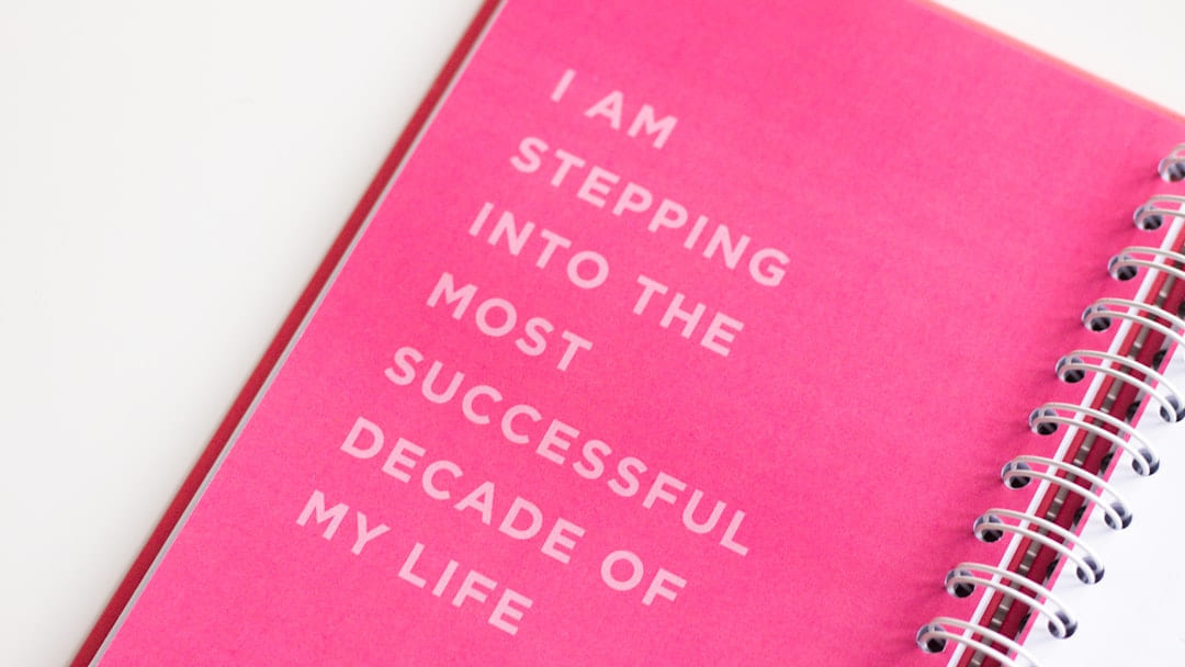 a pink notebook with a quote on it on Inner Progress Project
