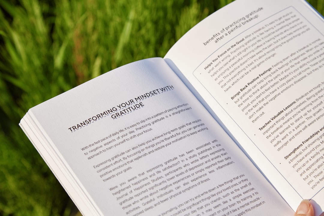 A person holding a book in their hands on Inner Progress Project