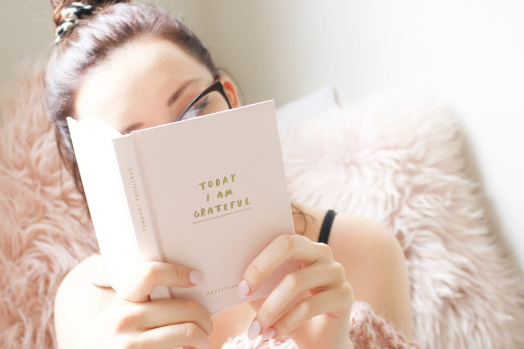 woman reading book on Inner Progress Project