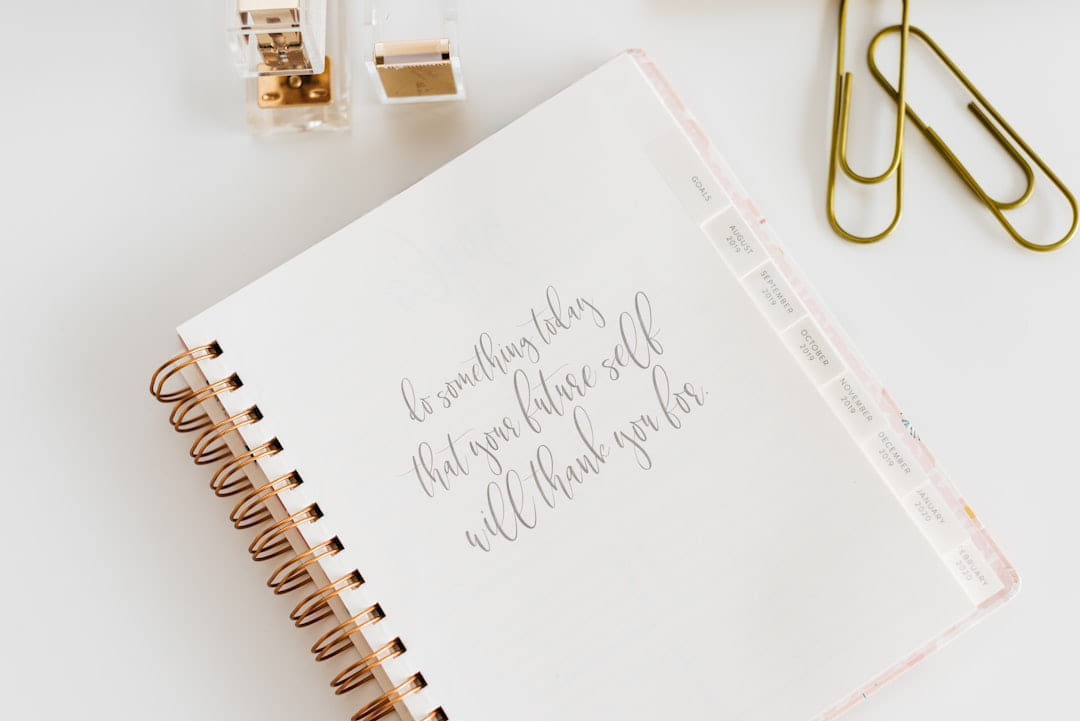 white spiral notebook on Inner Progress Project